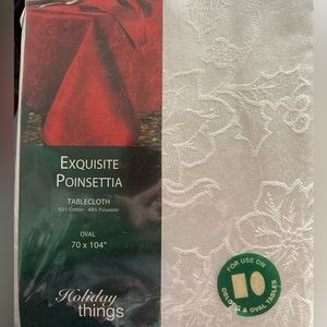 NEW UNOPENED “LINEN N THINGS”BRAND 70” X 104” OVAL SIZE POINSETTIA TABLECLOTH